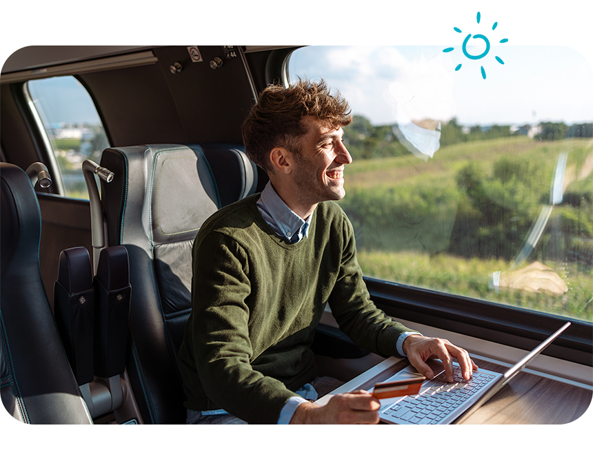 Guy on Train Looking Out the Window on computer